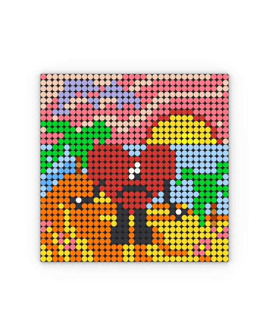 Mosaico cuadrado compuesto por piezas circulares estilo LEGO: un corazón rojo de aspecto triste sobre un fondo de playa con arena amarilla y naranja, palmeras verdes y un cielo degradado en tonos rosa y lila, con un sol amarillo parcialmente oculto en el horizonte. La imagen está inspirada en la portada del álbum Un Verano Sin Ti de Bad Bunny, reinterpretada con una estética pixelada y vibrante.